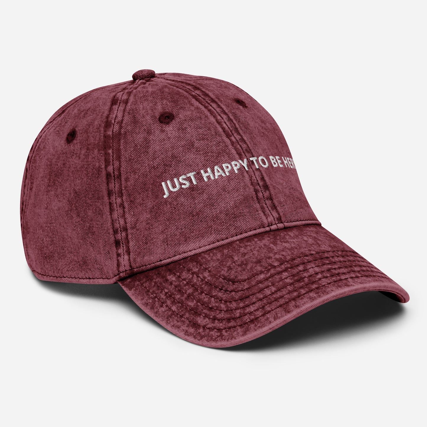 Red Side View Our "Just Happy to Be Here" Dad Hat is comfy, adjustable, and perfect for everyday wear. Whether you’re traveling in Kazakhstan or snacking on the couch, this embroidered baseball cap adds a positive touch to any outfit.