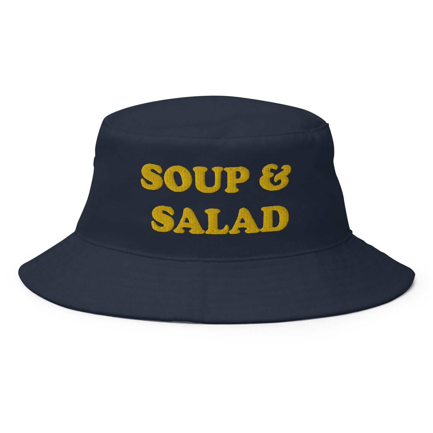 Navy Soup and Salad Hat -- Make a statement in our Soup & Salad Bucket Hat. It's comfortable and comes in a variety of colors with a a funny foodie design, expertly embroidered across the front. The perfect bucket hat for everything from beach adventures to grocery shopping. Eat your favorite foods in this funny hat or give it as a gift to your favorite soup and salad enthusiast.