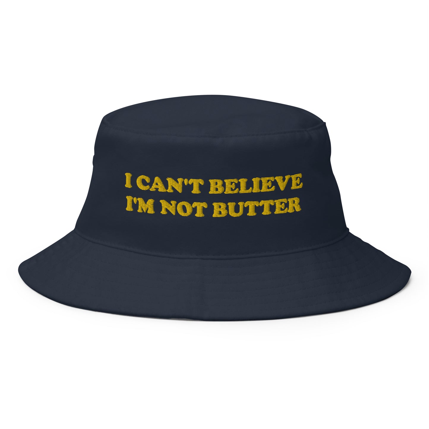 Navy I Can't Believe I'm Not Butter Bucket Hat - Our I Can't Believe I'm Not Butter Bucket Hat is comfortable and perfect for any occasion. It's a classic cotton bucket hat with a funny saying, expertly embroidered on the front.