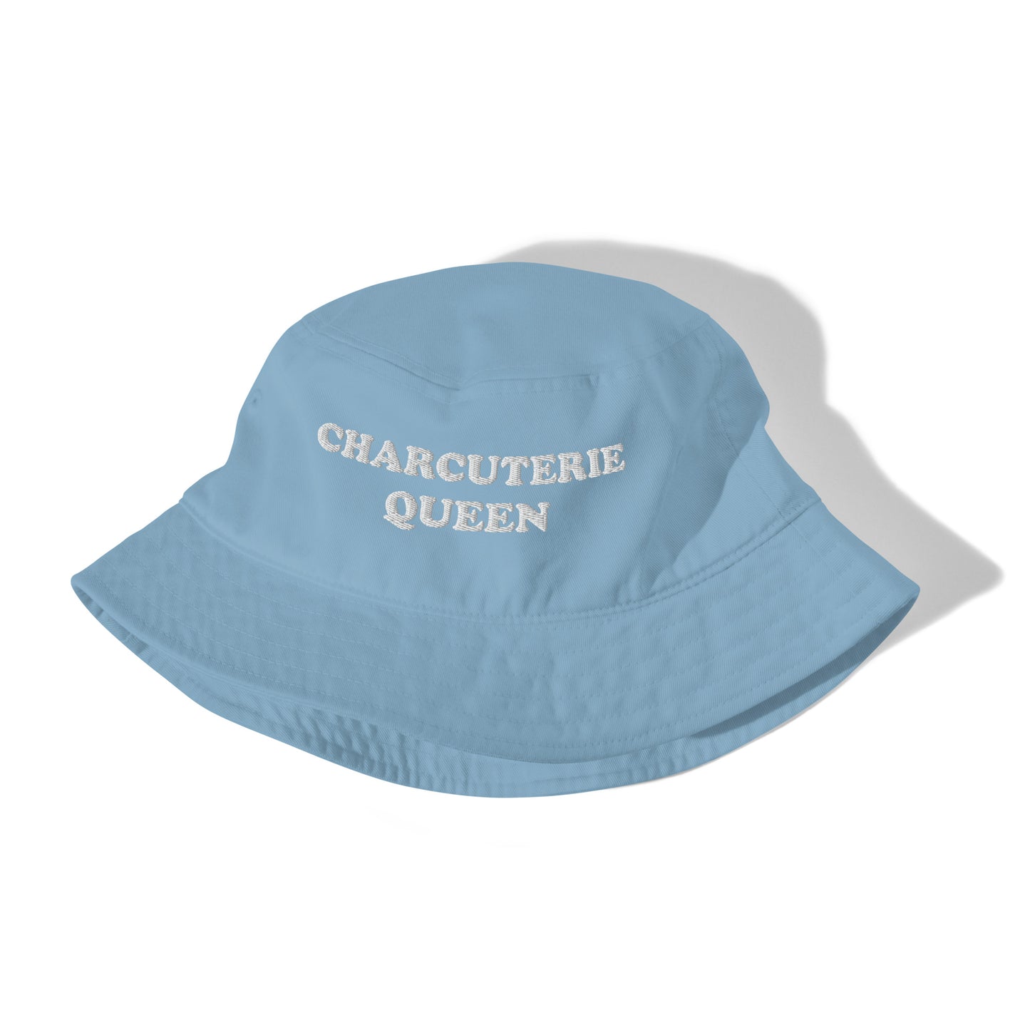 Blue bucket hat for charcuterie lovers - An embroidered charcuterie bucket hat for foodies and charcuterie enthusiasts. It's a unique bucket hat that's organic cotton, funny, comfortable and made just for you. Make a statement white you build your perfect charcuterie board or give it as an eco friendly funny gift for charcuterie lovers and queens.