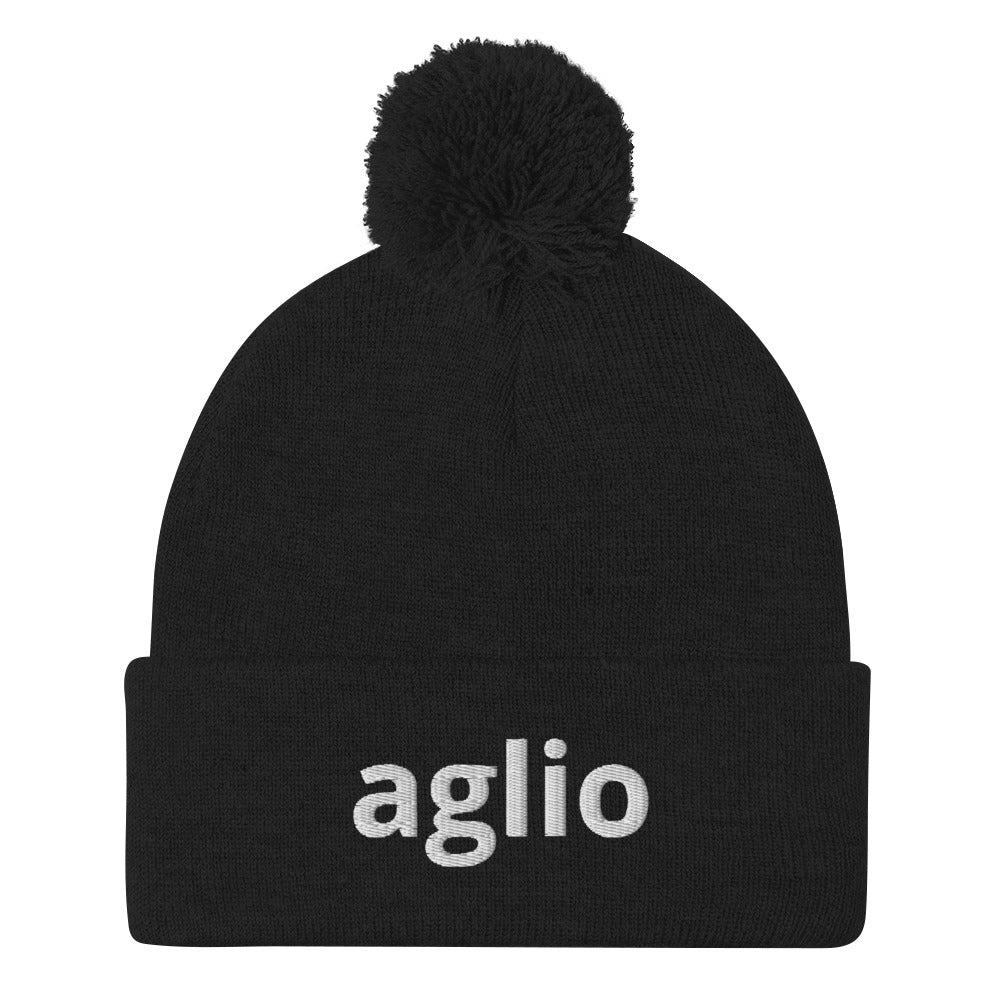 Black aglio beanie from Nina's Funky Shop by ninanush - An Italian garlic beanie for aglio lovers. This aglio hat is a classic pom pom beanie with a funny Italian word embroidery. The perfect cozy hat for Italians, garlic enthusiasts and foodies of all kinds. Stand out and share your love of garlic in this Italian garlic hat or give it as a cute gift for an Italian foodie.
