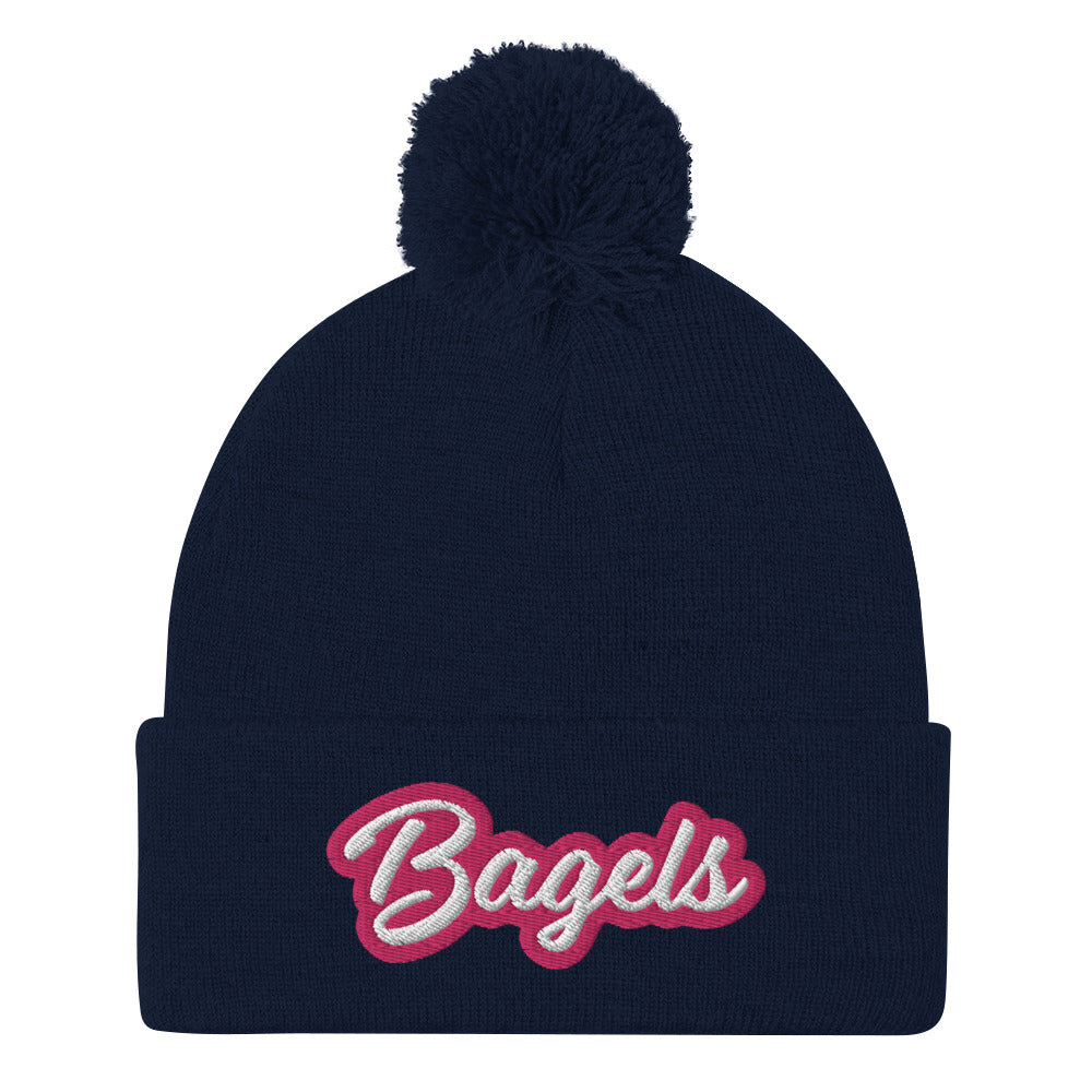 Navy beanie with pink and white embroidery for bagel lovers - Calling all bagel babes! Stay warm and make a statement in our pink and white embroidered beanie for bagel lovers. This funny foodie hat stands out and comes in a variety of colors. It's a unique bagel beanie that's comfortable and made just for you. Eat bagels in style or give it as a funny gift for bagel enthusiasts.