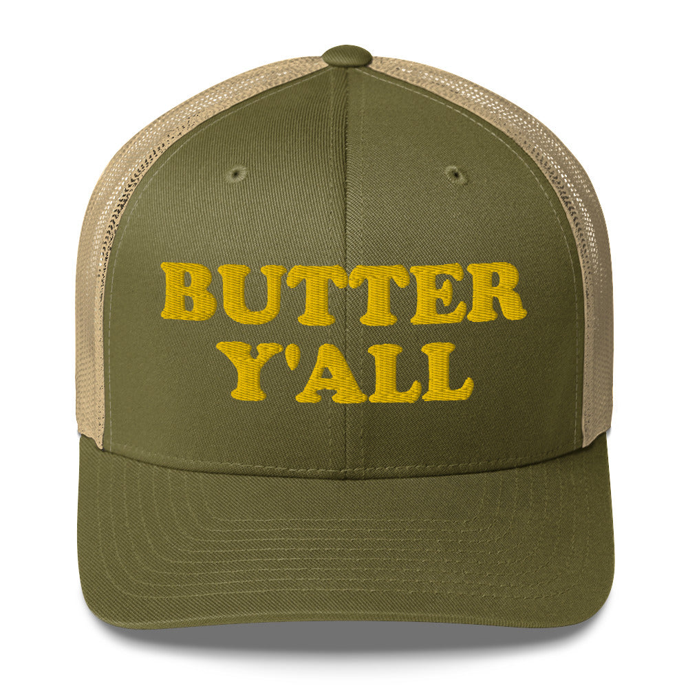 Green and khaki Butter Hat - Are you a butter enthusiast? Looking for a funny gift? Our Butter Y'all Hat is comfortable and made just for you. It comes in a variety of colors with a funny butter phrase, expertly embroidered on the front. Make a statement and eat your favorite buttery foods in our butter y'all trucker hat. Edit alt text