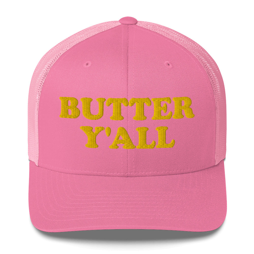 Pink Butter Hat - Are you a butter enthusiast? Looking for a funny gift? Our Butter Y'all Hat is comfortable and made just for you. It comes in a variety of colors with a funny butter phrase, expertly embroidered on the front. Make a statement and eat your favorite buttery foods in our butter y'all trucker hat. Edit alt text