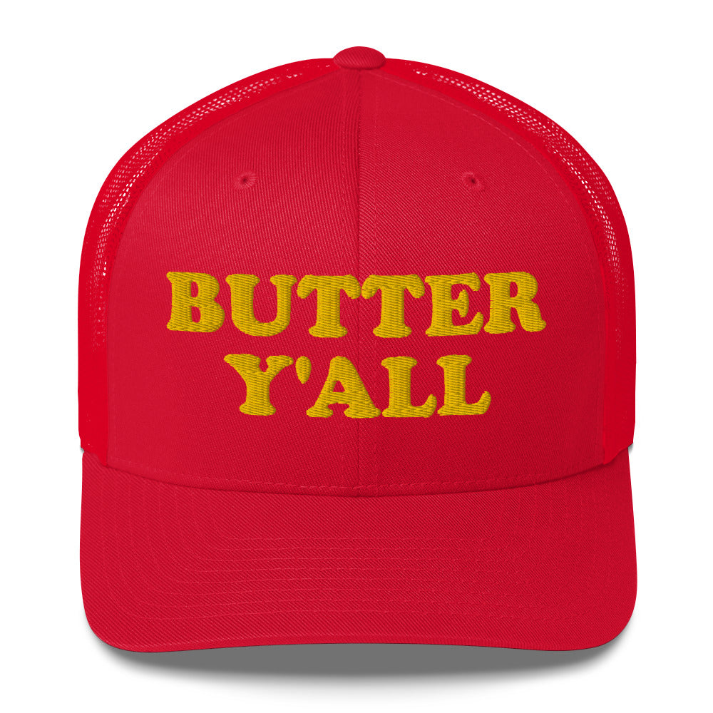Red Butter Hat - Are you a butter enthusiast? Looking for a funny gift? Our Butter Y'all Hat is comfortable and made just for you. It comes in a variety of colors with a funny butter phrase, expertly embroidered on the front. Make a statement and eat your favorite buttery foods in our butter y'all trucker hat. Edit alt text