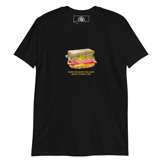 Black Sandwich T-Shirt -Do you love Sandwiches? Looking for a funny gift for a friend? Our colorful Sandwich T-shirt is just what you need. It's a soft and comfortable sandwich lover shirt with an original funky design by Nina, expertly printed on the front. It features a loaded sandwich with the words "Sandwich" and "Burn for what you love - quality since 1762 -" in yellow.