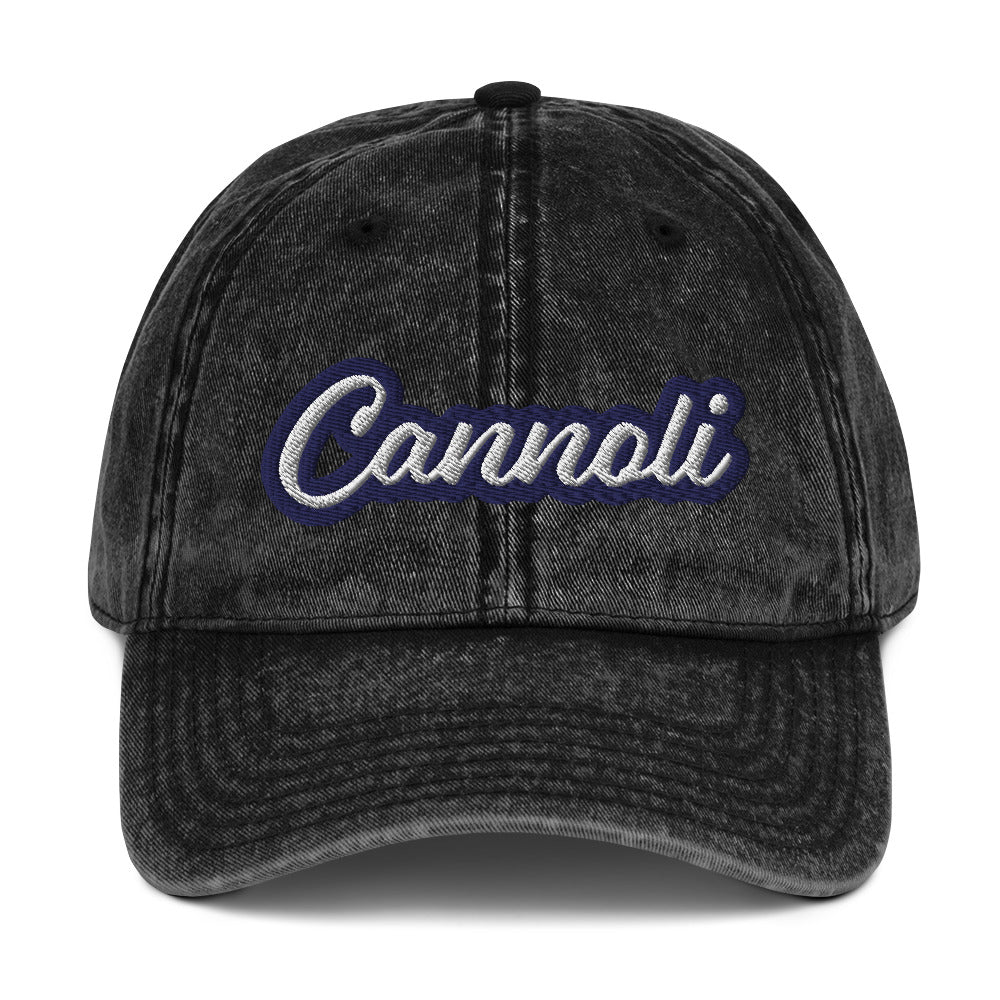 Black cannoli hat - A unique dad can designed for cannoli lovers and foodies. Eat your favorite cannoli in style and show off your love for this classic Italian dessert in our unique foodie dad hat. This cannoli hat is has a washed out vintage style and a white and blue embroidery. Perfect for cannoli lovers and foodies of all kinds.