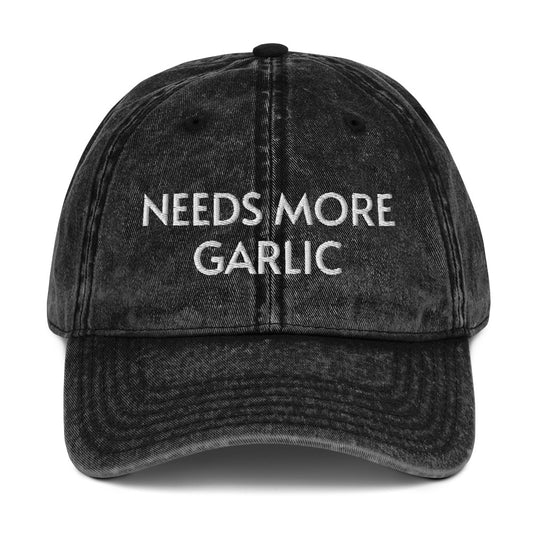 Black needs more garlic dad hat from Nina's Funky Shop by ninanush - If you're a garlic enthusiast, this funny food hat was designed just for you. Eat garlicky snacks in style and show off your love for garlic in our unique foodie dad hat. This garlic lover hat is made of cotton, with a washed out vintage style and an eye-catching embroidery. Perfect for garlic lovers and foodies.