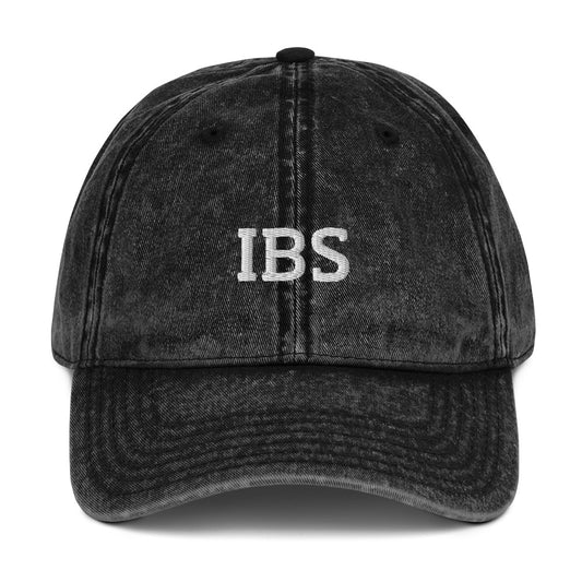 Black IBS dad hat from Nina's Funky Shop by ninanush - Share your gastrointestinal condition with the world in our IBS hat. Its a funny hat that has a stylish washed out material and "IBS" on the front. It's the perfect dad hat for foodies with IBS or a funny gift for a friend with IBS. Celebrate your favorite food and drinks in our funky foodie apparel, designed by Nina.