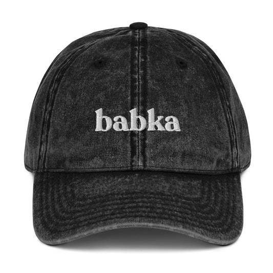Black Babka Dad Hat from Nina's Funky Shop by ninanush - Do you love babka? Looking for a unique foodie gift? Look no further! This babka hat is just what you need. Celebrate this delicious dessert with a fun foodie dad hat. It's a comfortable embroidered dad hat with a stylish washed out cotton material. The perfect hat for babka enthusiasts and foodies of all kinds. Celebrate your favorite food and drinks in our funky foodie apparel, designed by Nina and made just for you.