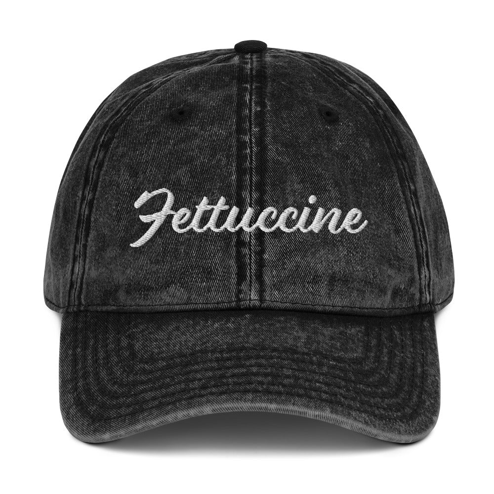 Black Fettuccine Hat - Love fettuccine? Looking for a funny gift for a pasta enthusiast? This Unique Fettuccine Hat is just what you need. It's comfortable, and comes in a variety of colors with "Fettuccine", expertly embroidered on the front. Eat your favorite pasta in this funny foodie dad hat. Perfect for fettuccine lovers and beyond.