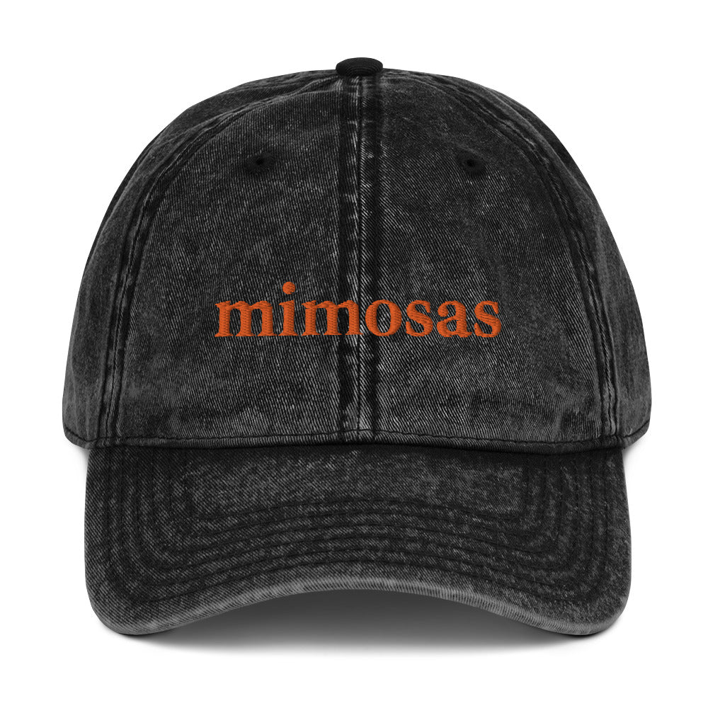 Black Mimosas hat - Drink your favorite cocktail in our Mimosas Hat! It's a classic dad hat with "mimosas" expertly embroidered on the front. The perfect hat for everyday streetwear or a gift for a mimosa enthusiast.