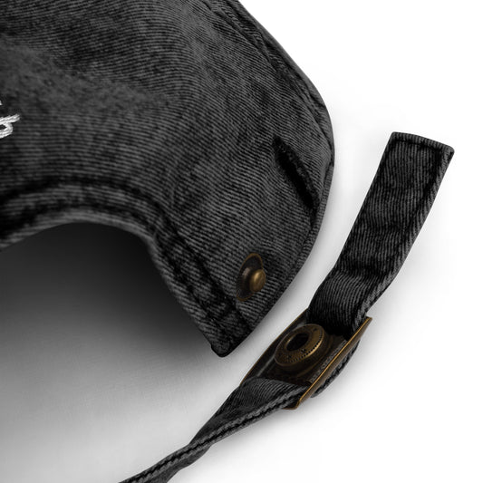 Back adjustable snap closure of faded black weird dad hat - This weird dad hat is comfortable, adjustable and is made just for you. It's a classic unstructured hat with the word "weird" embroidered on the front. This vintage-style dad hat is adjustable and comes in a variety of stylish faded colors. Wear this weird hat as everyday wear or give it as a gift for a weird friend.