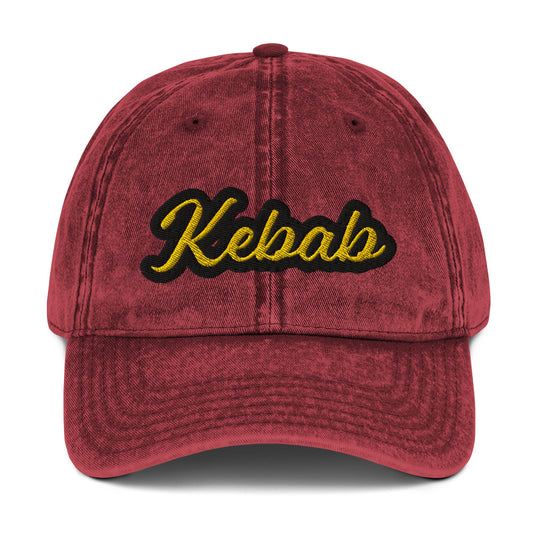 Maroon kebab dad hat - This kebab dad hat, made of cotton, is designed for kebab enthusiasts. The hat showcases a washed-out cotton material with vintage-style embroidery. It's the ideal funny food hat for both kebab lovers and Middle Eastern foodies. This kebab hat is a unique, statement accessory for foodies or gift for kebab aficionados.