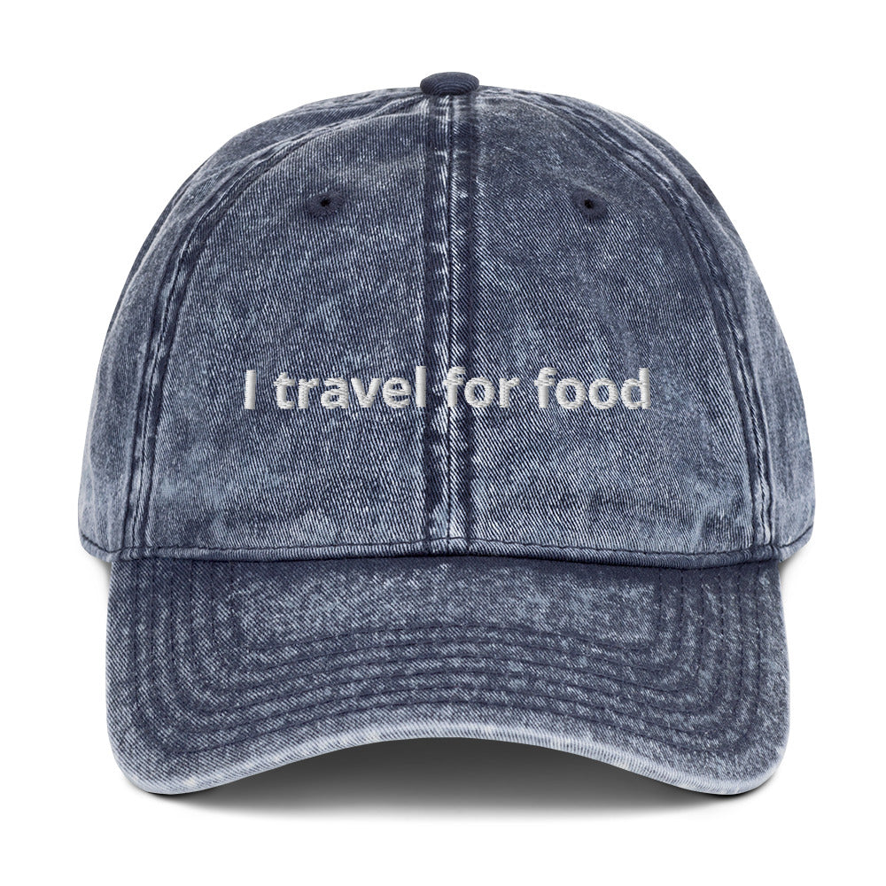 Blue I Travel For Food Hat - $1000 flight to Thailand for $2 pad Thai? Yes please! Our "I travel for food" hat is comfortable and has an adjustable closure. It comes in a variety of colors with a funny travel saying for foodies, expertly embroidered on the front. This dad hat is perfect for travelers and foodies alike.