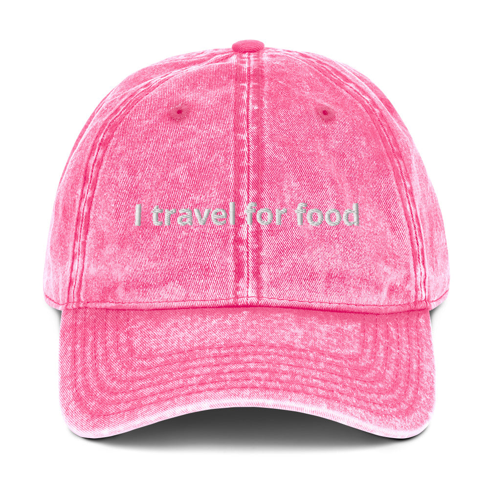 Pink I Travel For Food Hat - $1000 flight to Thailand for $2 pad Thai? Yes please! Our "I travel for food" hat is comfortable and has an adjustable closure. It comes in a variety of colors with a funny travel saying for foodies, expertly embroidered on the front. This dad hat is perfect for travelers and foodies alike.