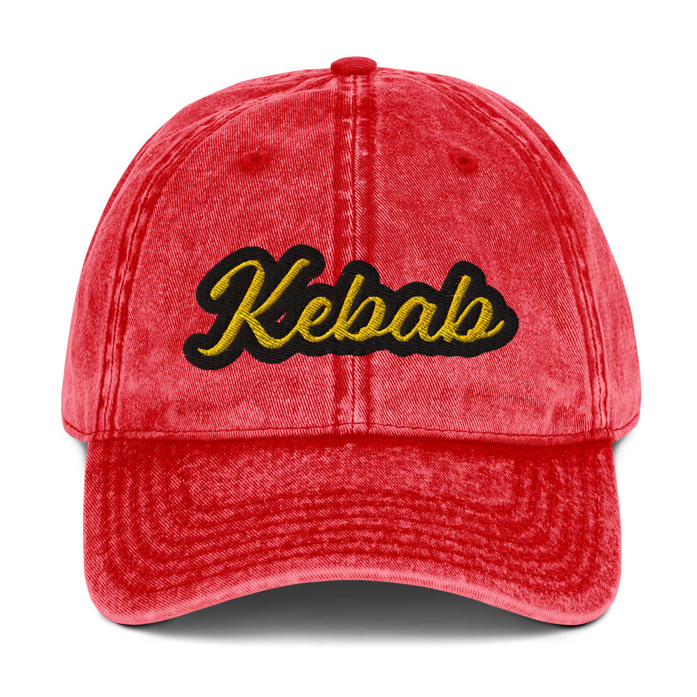 Red kebab dad hat - This kebab dad hat, made of cotton, is designed for kebab enthusiasts. The hat showcases a washed-out cotton material with vintage-style embroidery. It's the ideal funny food hat for both kebab lovers and Middle Eastern foodies. This kebab hat is a unique, statement accessory for foodies or gift for kebab aficionados.