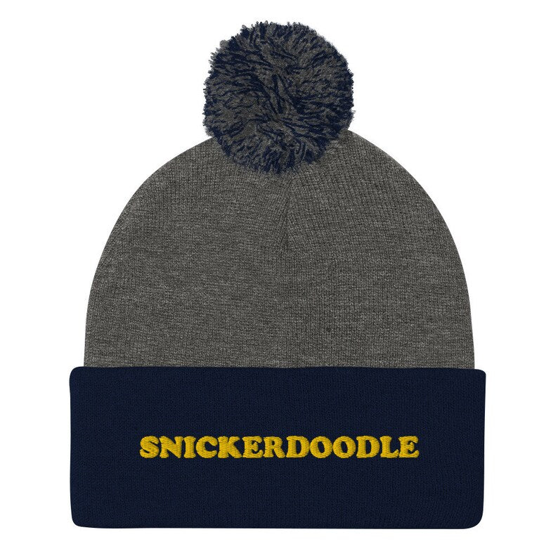 Navy blue and gray snickerdoodle hat - Eat snickerdoodles in style and make a statement in this snickerdoodle beanie. It's a warm and cozy hat for foodies and made just for you. The funny foodie snickerdoodle hat is a classic beanie with a pom pom and a unique embroidery. It's a weird beanie for cookie lovers and a funny gift for snickerdoodle enthusiasts.