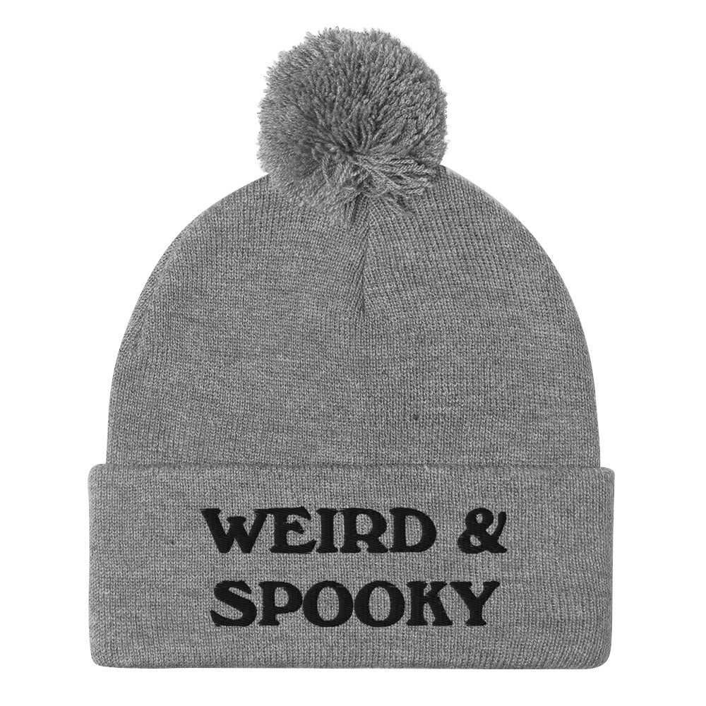 Gray and black weird and spooky beanie - Stay weird and spooky in this classic beanie with a pom pom on top. It's cute and cozy and just a little weird. So, celebrate your weirdness and individuality in our funky clothing and accessories. Be weird, be spooky, and be yourself in these colorful and unique beanies.