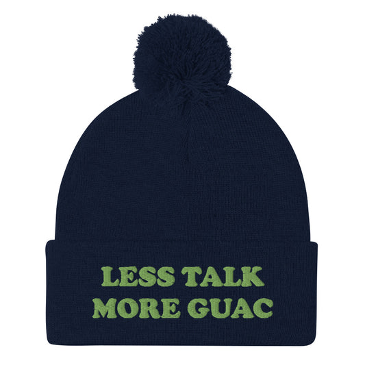Navy blue guacamole hat with green embroidery. Less talk more guac! Make your priorities clear in this unique guacamole beanie hat. It's a classic pom pom beanie with a funky foodie yellow embroidery. This funny food quote hat is a perfect foodie beanie or unique gift for guacamole lovers. Now you can wear a funky guacamole quote hat and eat guacamole in style.