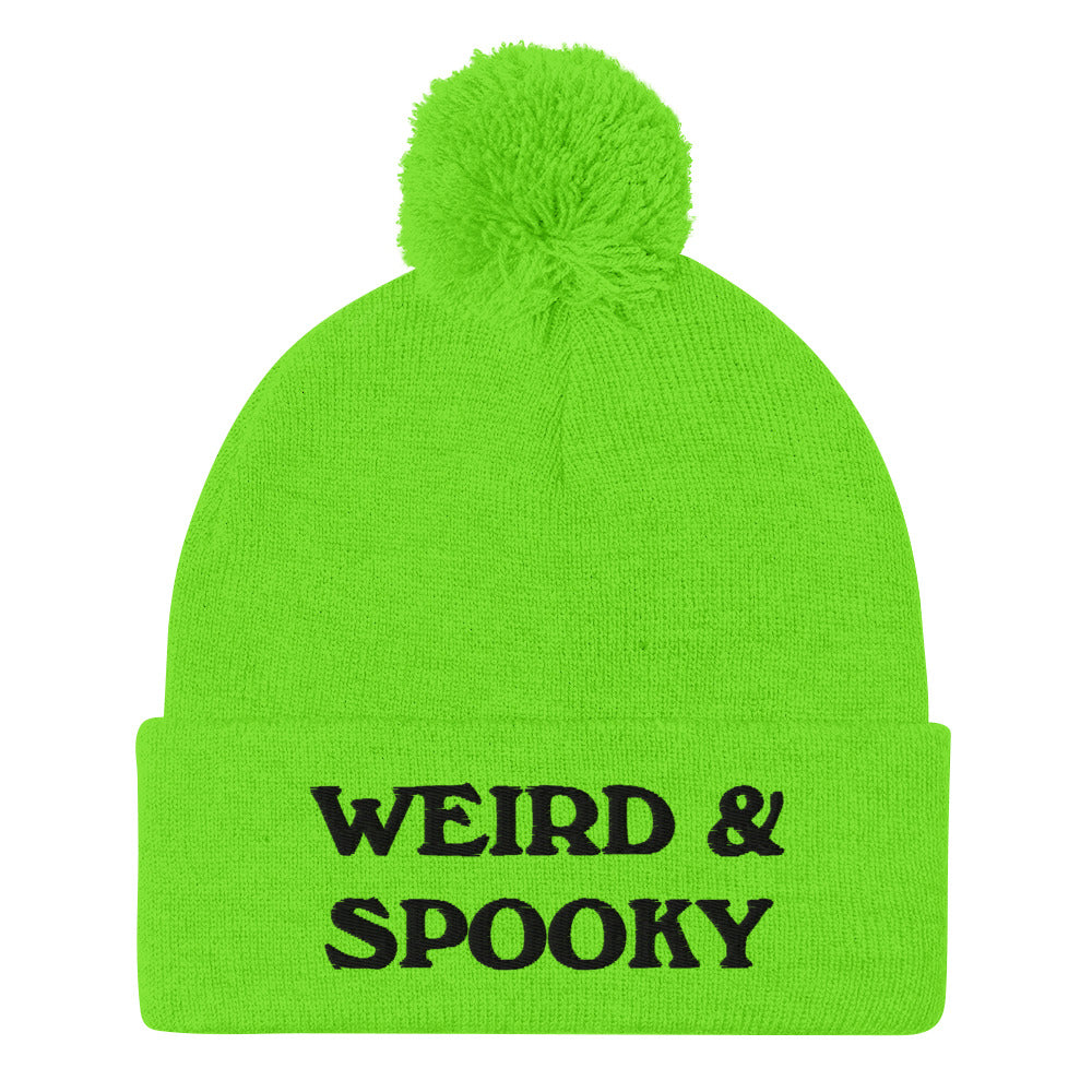 Green and black weird and spooky beanie - Stay weird and spooky in this classic beanie with a pom pom on top. It's cute and cozy and just a little weird. So, celebrate your weirdness and individuality in our funky clothing and accessories. Be weird, be spooky, and be yourself in these colorful and unique beanies.