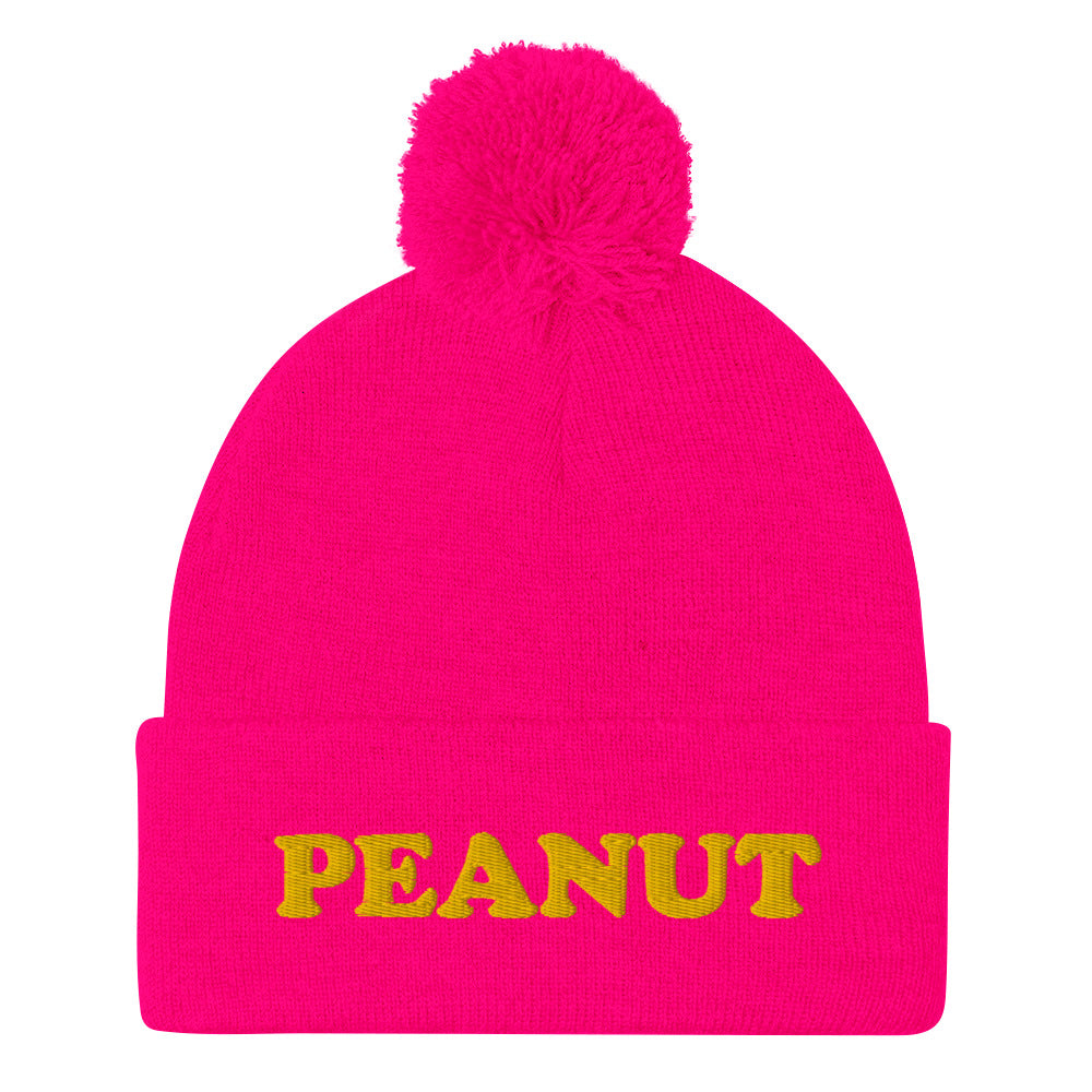 This "PEANUT" beanie hat is a perfect warm and cozy hat for cold weather. It's a classic beanie with a pom pom on top and a unique foodie embroidery. Our peanut beanie hat is part of our foodie clothing collection. Celebrate your favorite foods in our funky foodie beanies, weird hats, creative artsy hoodies, vegan tees and more