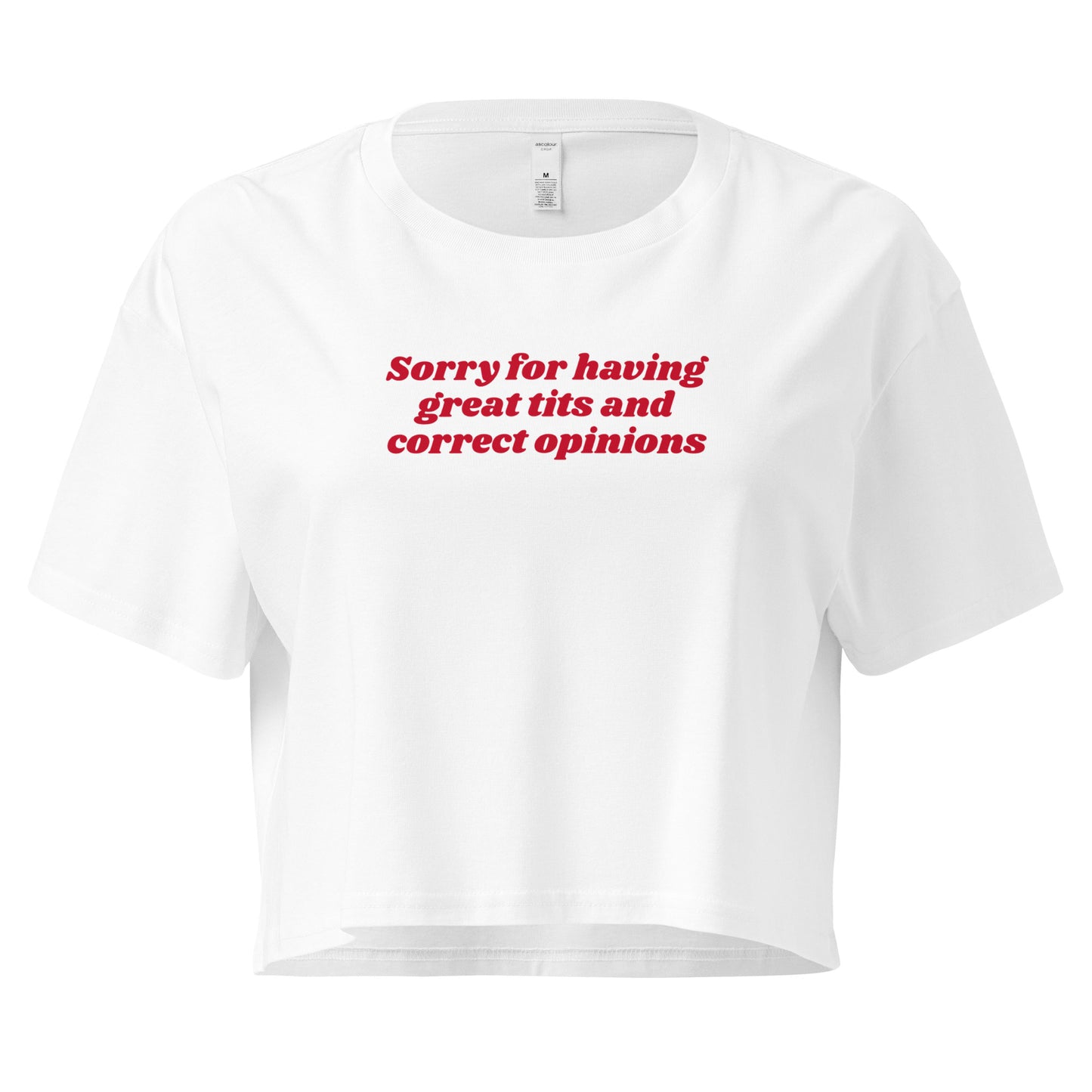 White crop t-shirt with the text 'Sorry for having great tits and correct opinions' printed in red on the front.