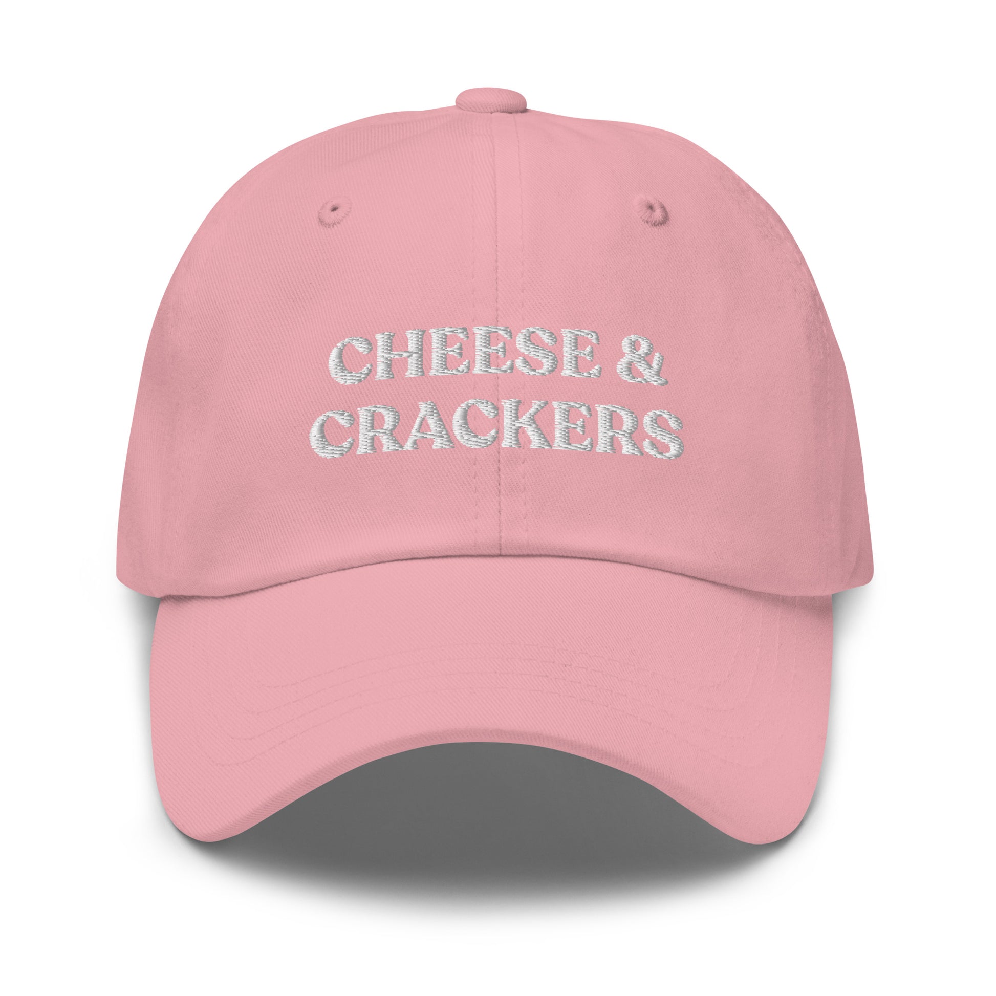 Pink Cheese and Crackers Hat - If you love cheese and crackers, this funny foodie dad hat might be just what you need! Our Cheese & Crackers Hat is comfortable, adjustable and comes in a variety of colors. It's a classic dad hat embroidered with your favorite foods. Perfect for everyday streetwear or a gift for a charcuterie king or queen.