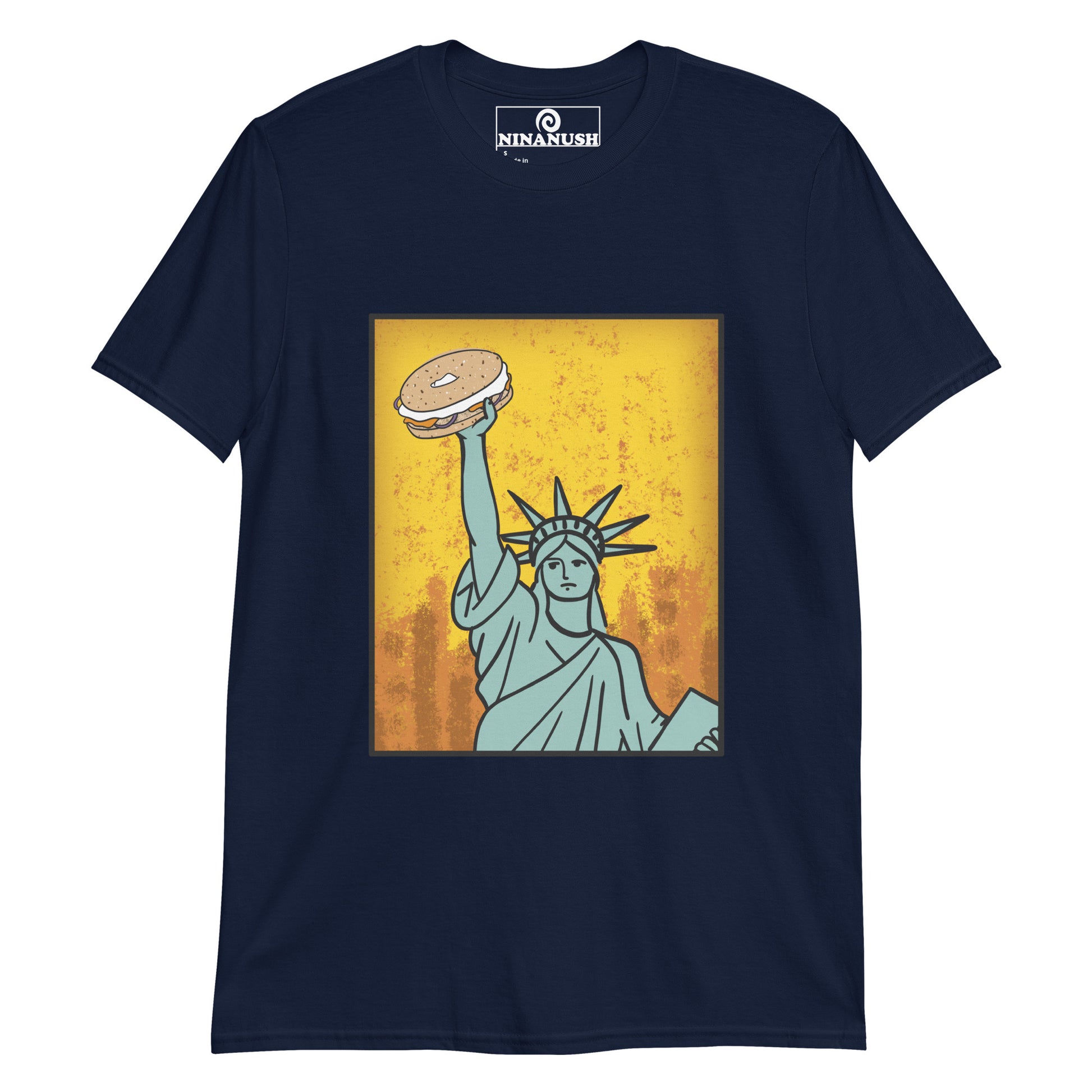 Navy blue bagel shirt - Funky Statue of Liberty T-shirt. Eat bagels in style in a funny food t-shirt for bagel lovers. It's a colorful graphic tee with a totally unique hand drawn design of the Statue of Liberty holding a bagel. It's just what every bagel enthusiast needs. Make a statement or give it as a funny gift for bagel lovers. 