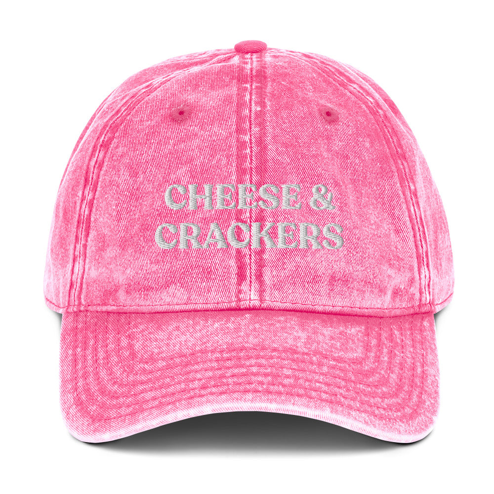 Pink cheese and crackers hat - Our Cheese & Crackers Hat is made of comfortable cotton and expertly embroidered just for you. It's a classic dad hat that's perfect for everyday streetwear that will have people asking "Where'd you get that hat?" Make a statement in this funny foodie dad hat.